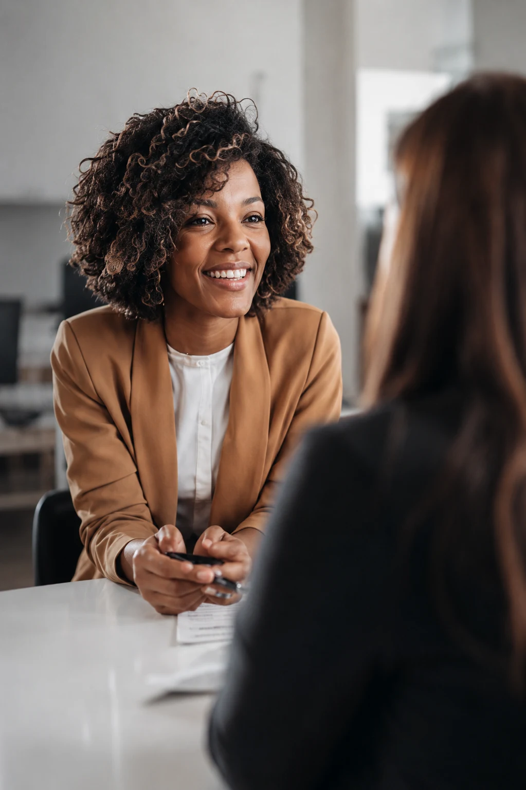 A Kindred HR adviser listening during a calm client conversation.